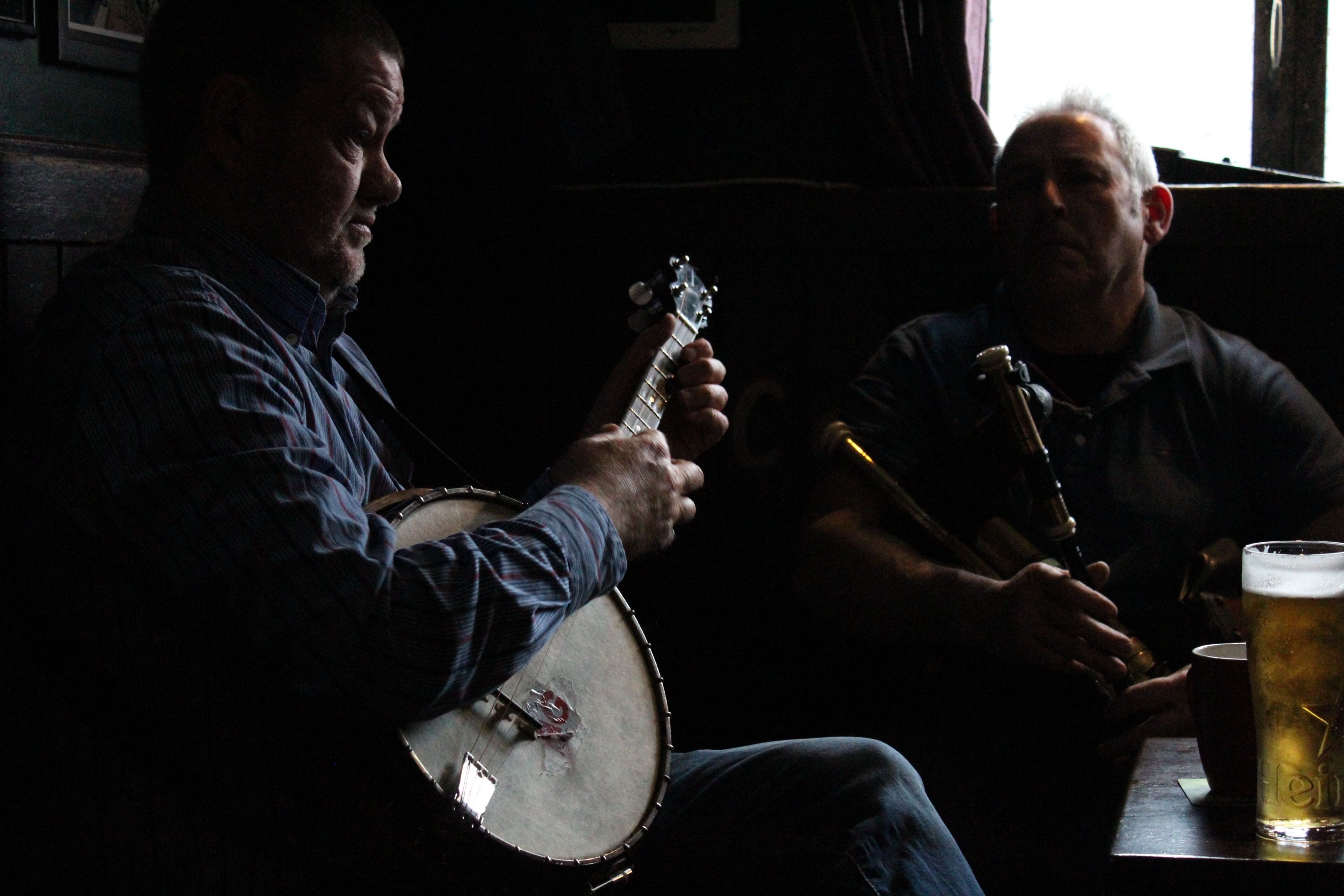 2 Men playing traditional music in a pub