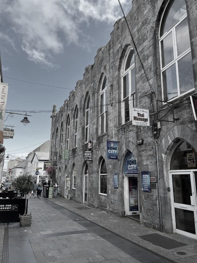 An outside view of Galway's Pro-Cathedral Parish Church. The sky is slightly overcast.